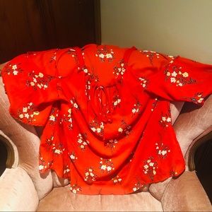 Red floral blouse